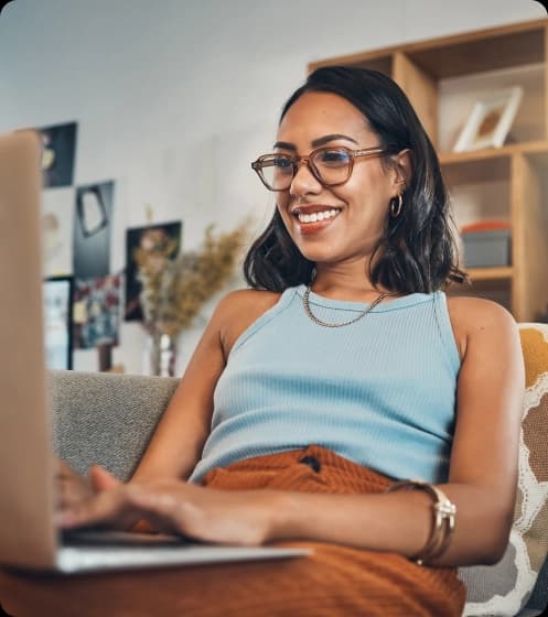 Smiling woman on laptop